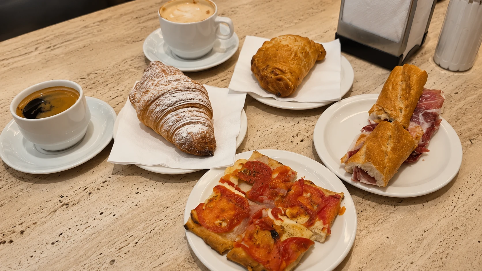 Forn Mistral Sant Antoni Barcelona pastries, espresso, and coffee on a bakery table